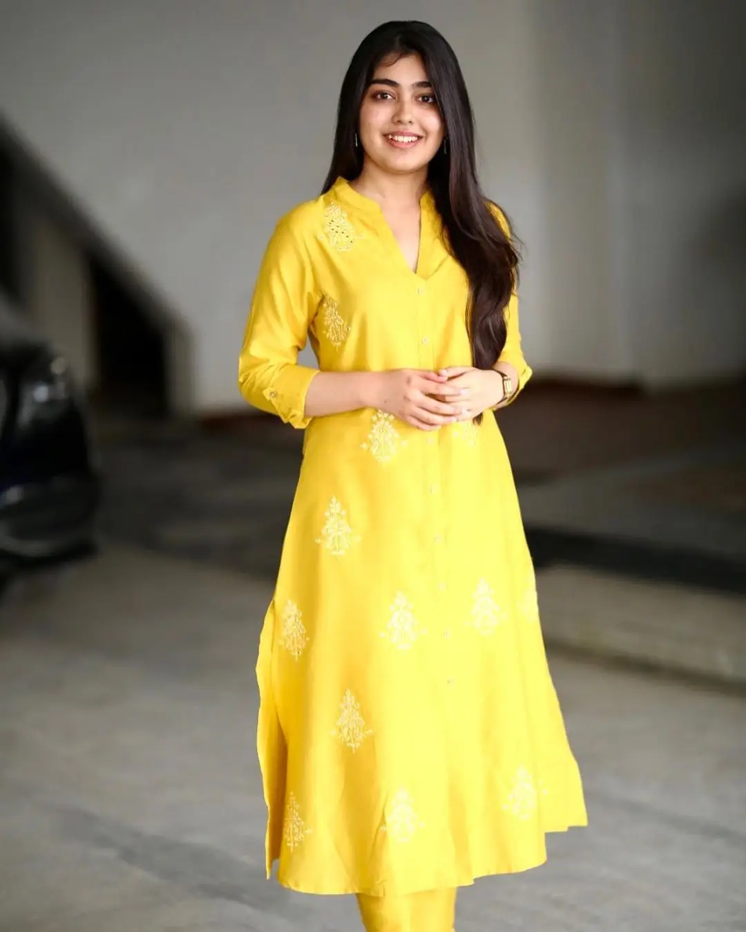 Gargeyi Yellapragada Smiling Face Long Hair Yellow Dress